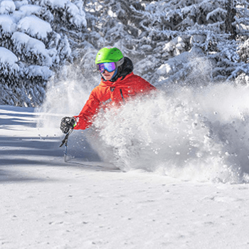 skier spraying powder snow