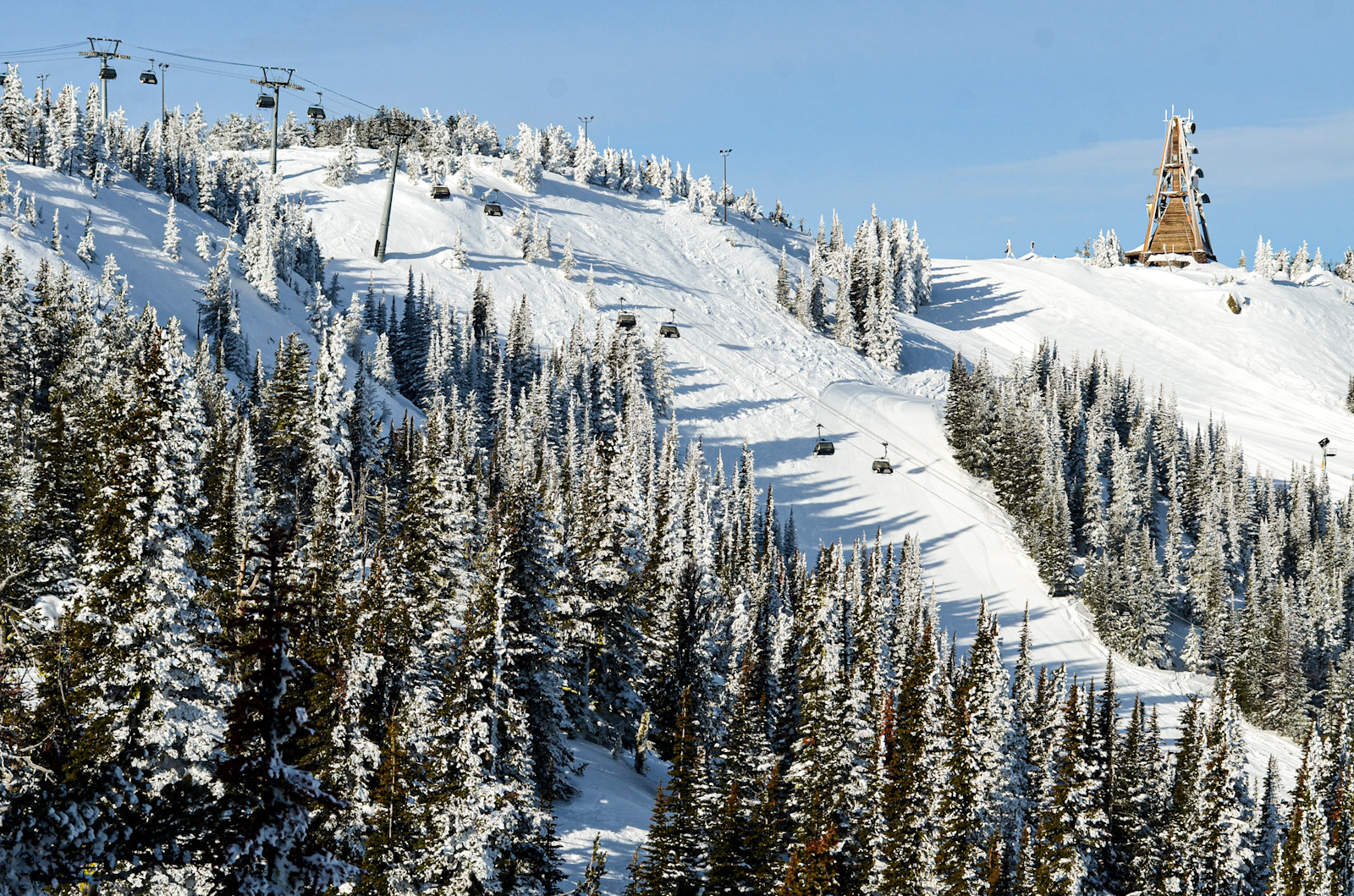 View of bubble chairlift at Mission Ridge from a distance on a sunny day