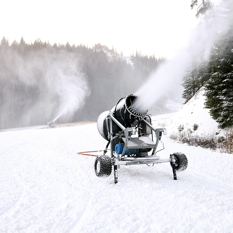 Snow guns blowing snow on Mimi run at Mission Ridge