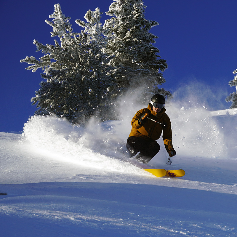 Skier making powder turn at the top of Cahir 2 Mission Ridge