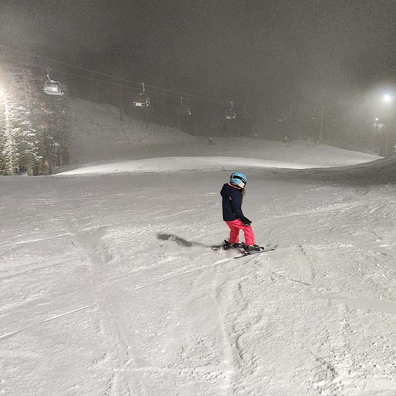 Young skier on Tumwater run at Mission Ridge under the lights