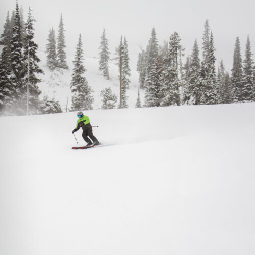 Skier in green jacket on Tumwater
