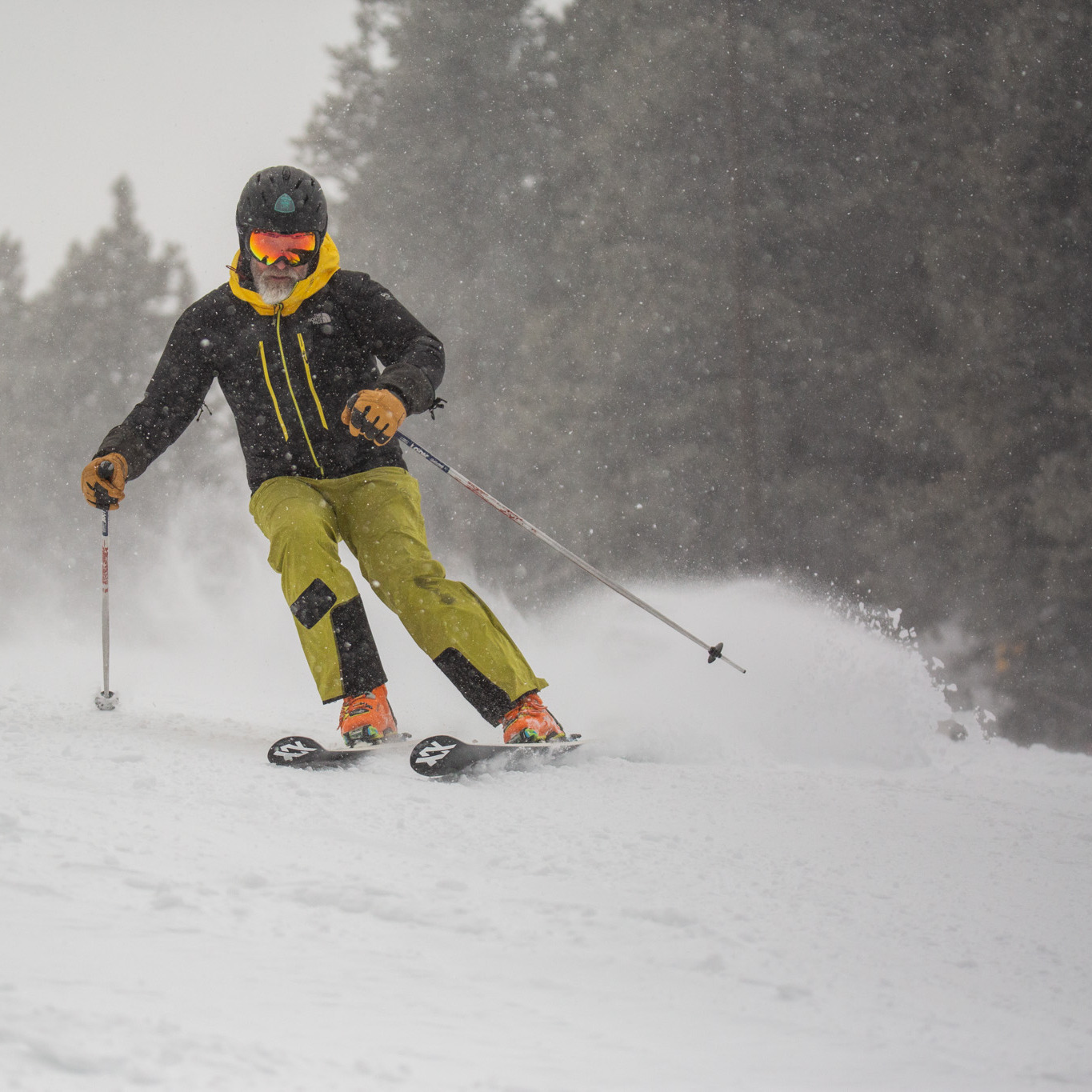Skier carving turns on sunspot