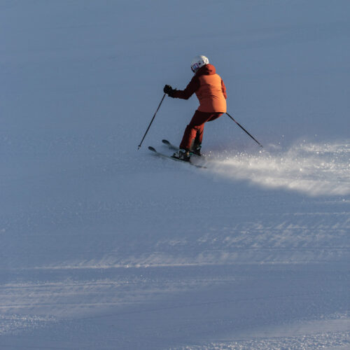 Skier in red going down Sunspot