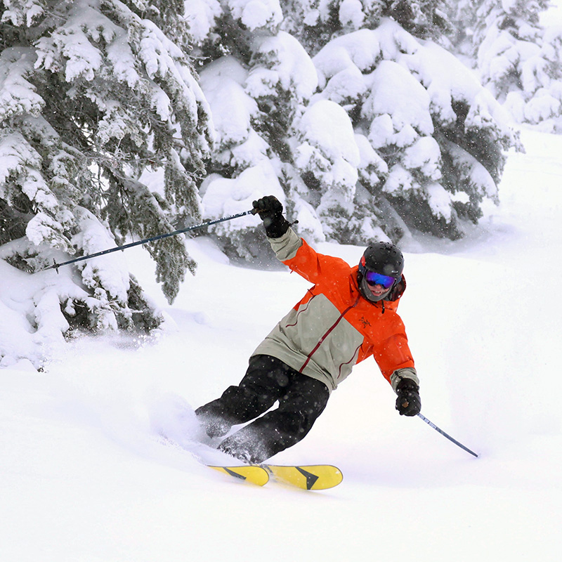 Skier making powder turn at Mission Ridge