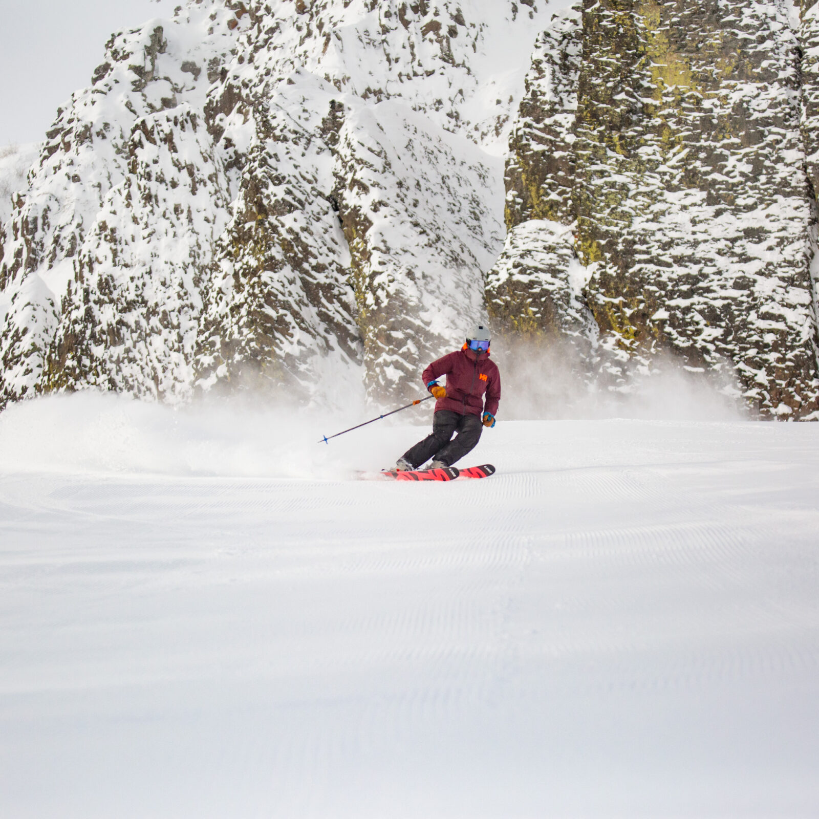 Bomber cliffs, red jacket skier