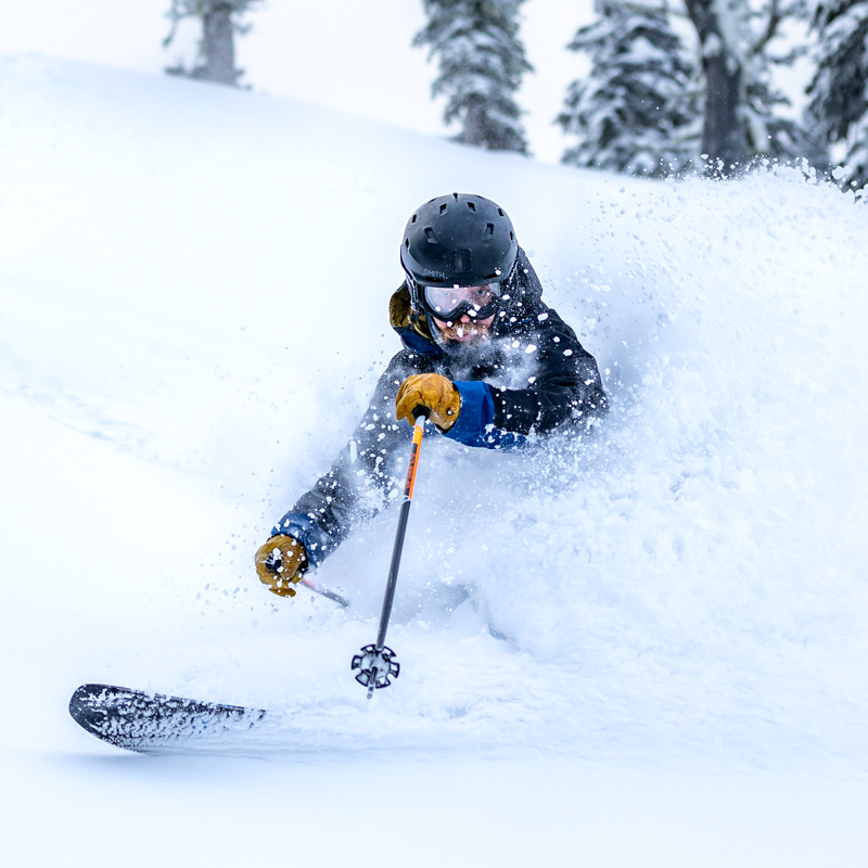 Telemark skier punching through the fresh POW