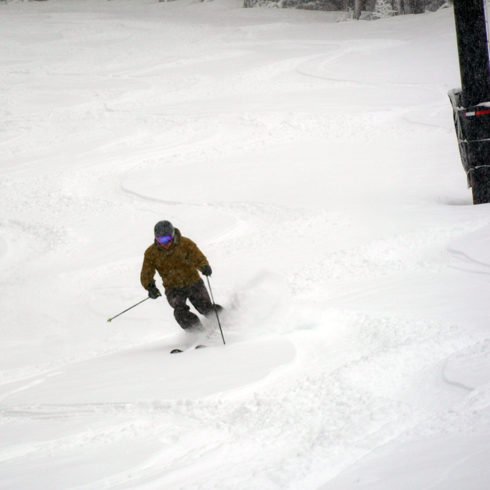 Skier making powder turn at Mission Ridge