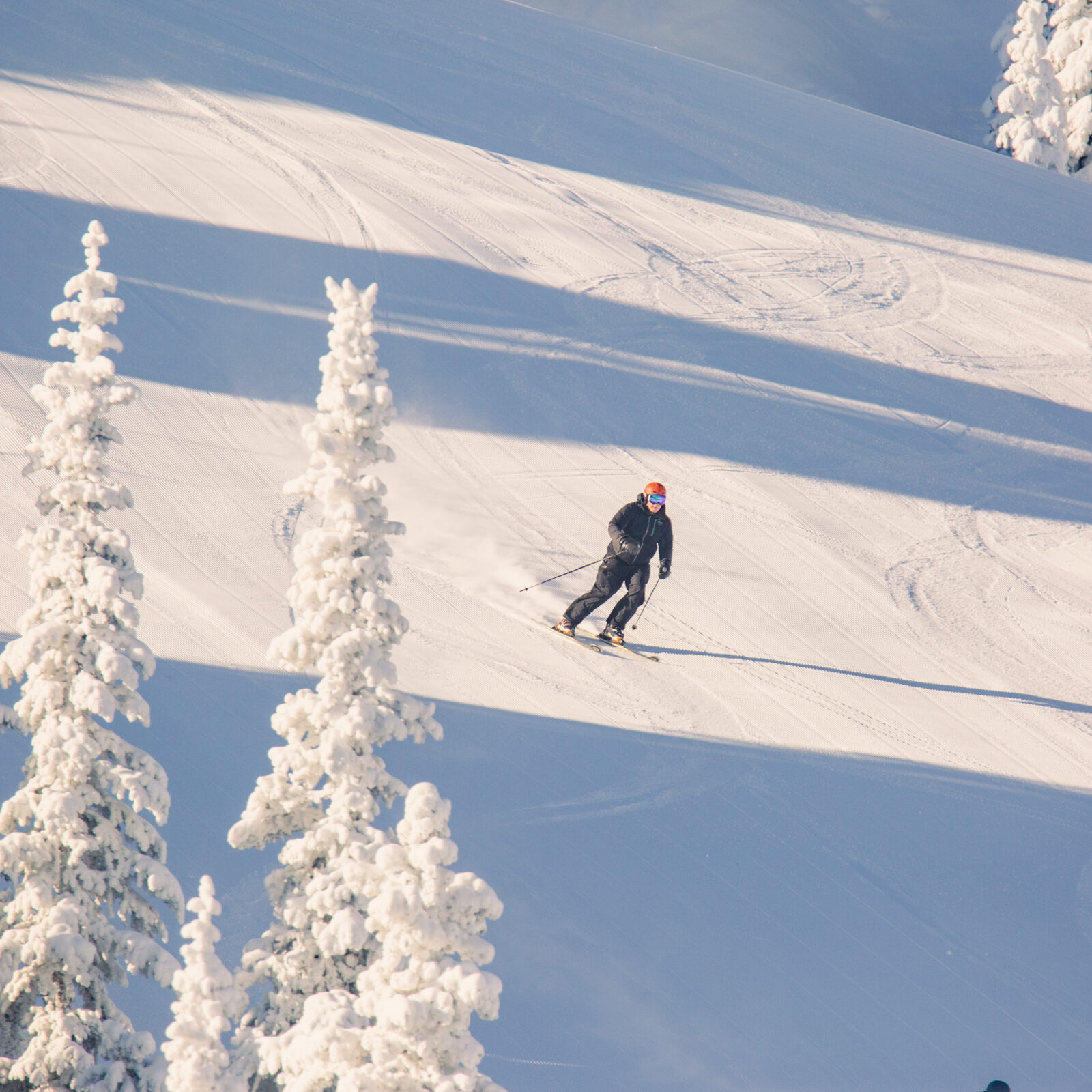 Sunspot Skier making turns on groomed runs