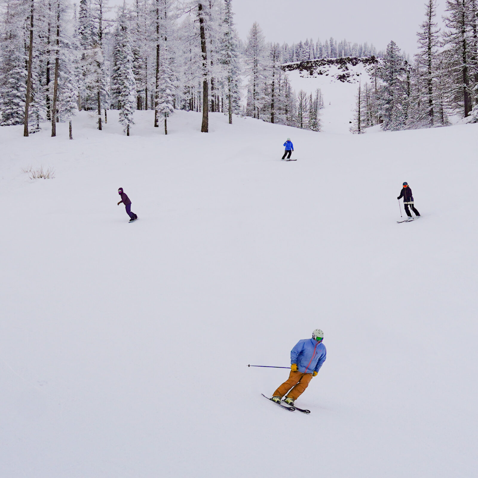 Four skiers on Mission Ridge, chair 2