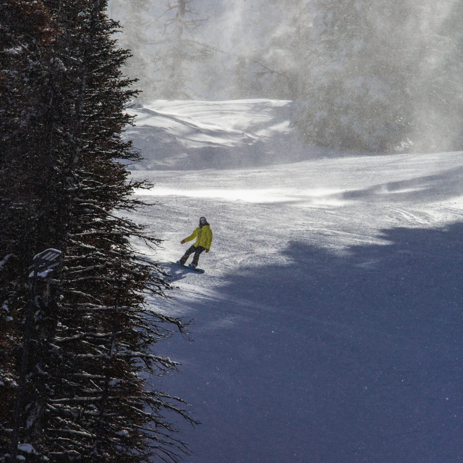 Snowboarder making turns down lower chak chak.