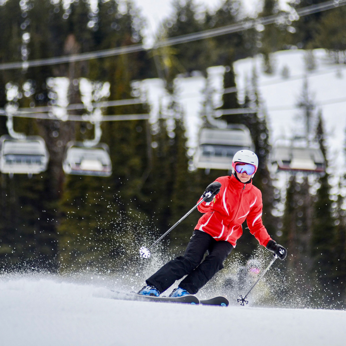 lady in a red jacket skiing on the groomers, Tumwater.