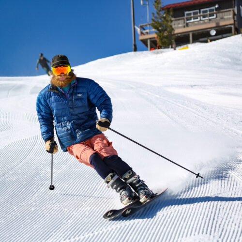 Skier in shorts, carving on Sun Spot