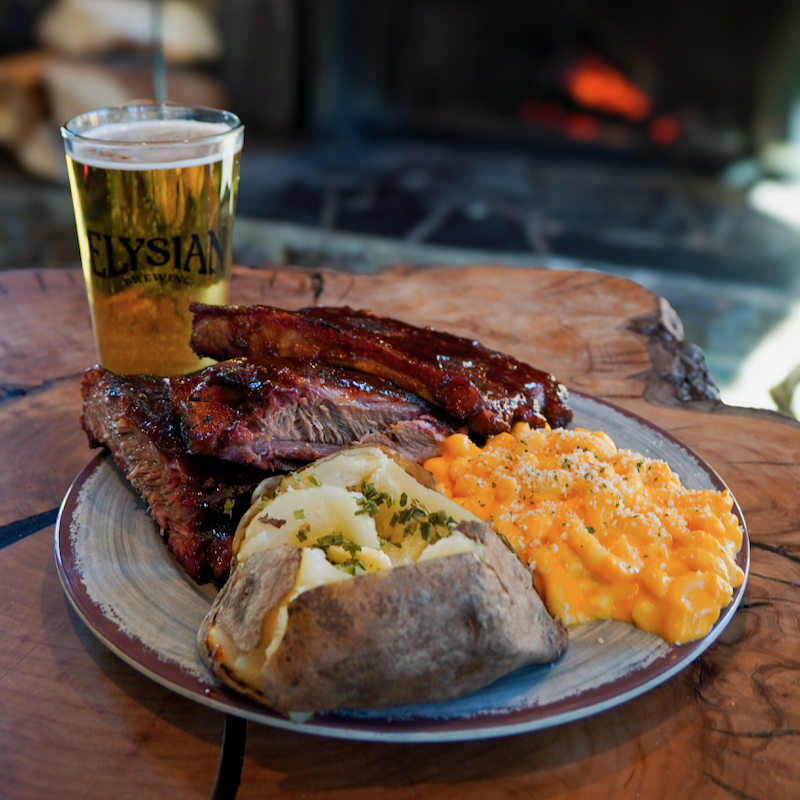 A meal of ribs, baked potato, and Mac and cheese with a beer in the Hampton Lodge at Mission Ridge.