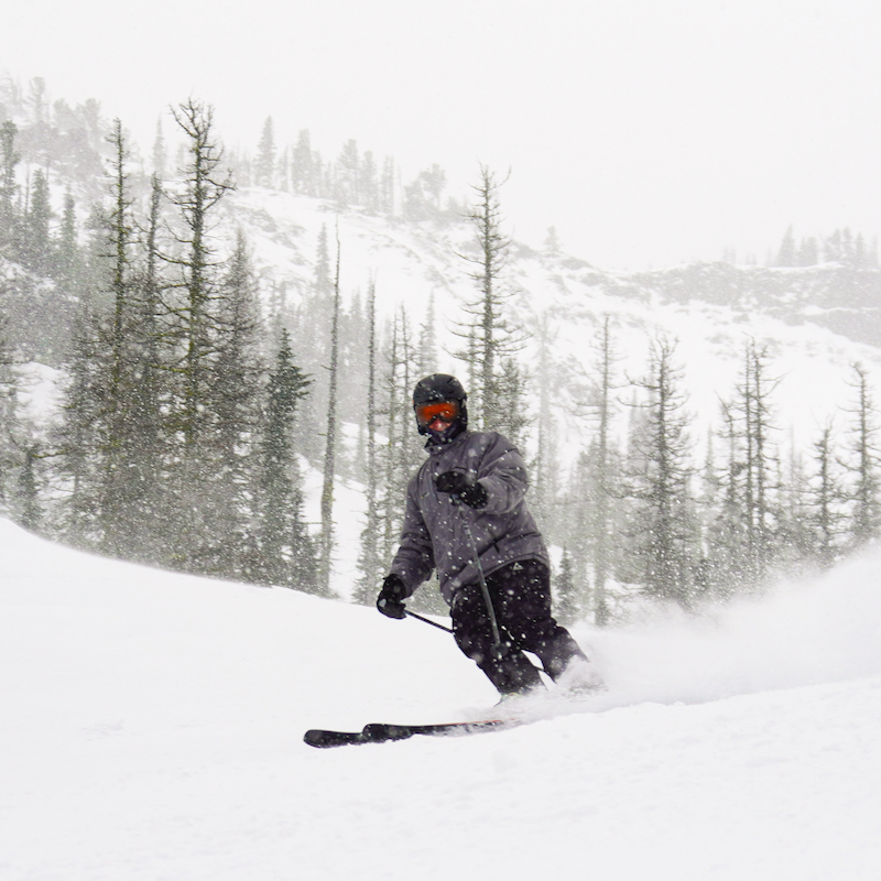 A skier descends the Upper Chak Chak trail at Mission Ridge as fresh snow falls.