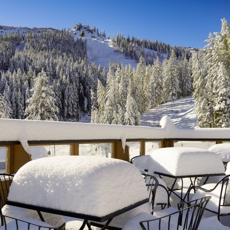 A fresh snowfall blanketing tables at Mission Ridge ski area.