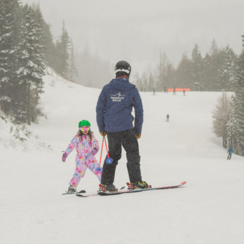 a young skier works with an instructor on the Mimi trail at Mission Ridge