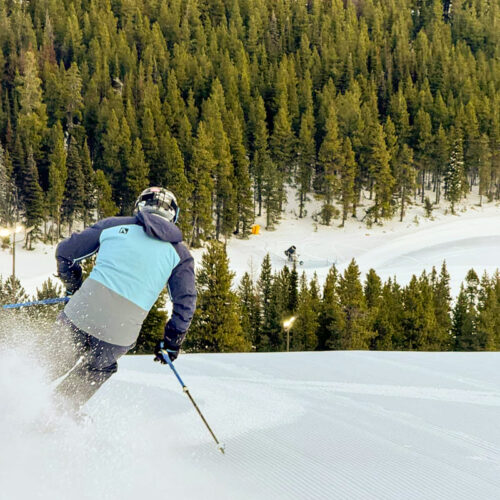A man skis a sunny slope