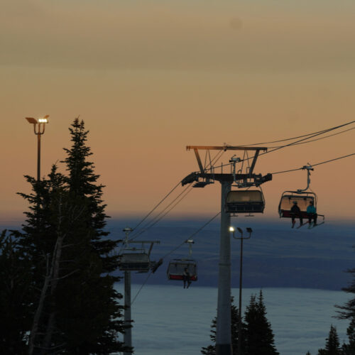 Chair 2 at Mission Ridge in front of an orange sunset