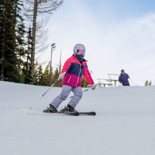 A kid descends the Tumwater Trail at Mission Ridge on a party sunny day.