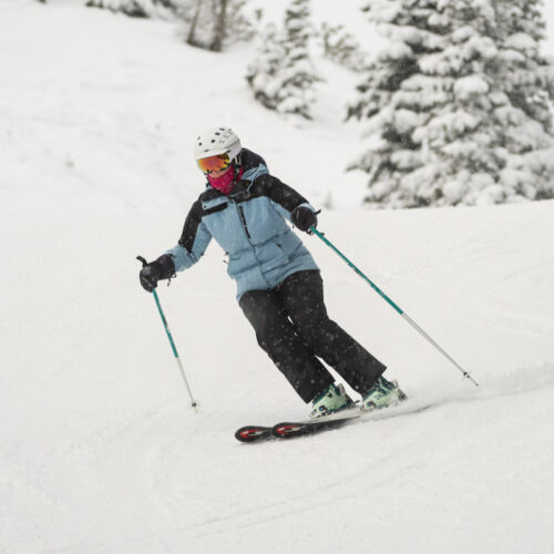 A skier descends the Tumwater trail at Mission ridge on a snowy day.