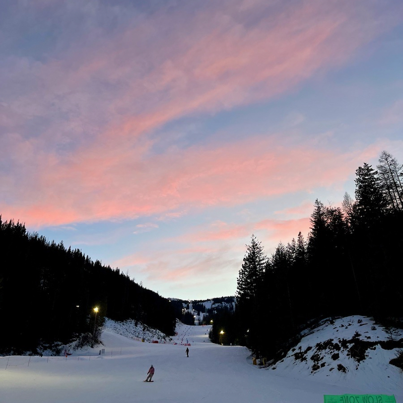 View up the Mimi trail at Mission Ridge around sunset, with pink clouds above a mountainous foreground.