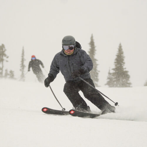 A skier descends the Tumwater trail at Mission Ridge as snow falls.