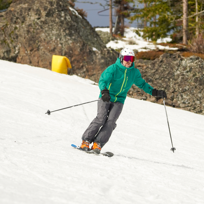 A skier descends the Sitkum trail at Mission Ridge on a spring-like day.
