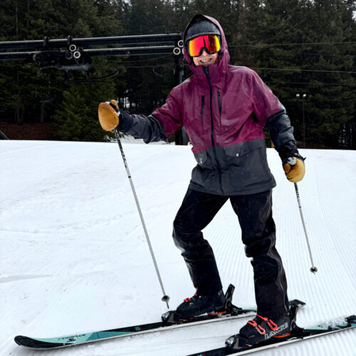 a smiling skier male 60 plus