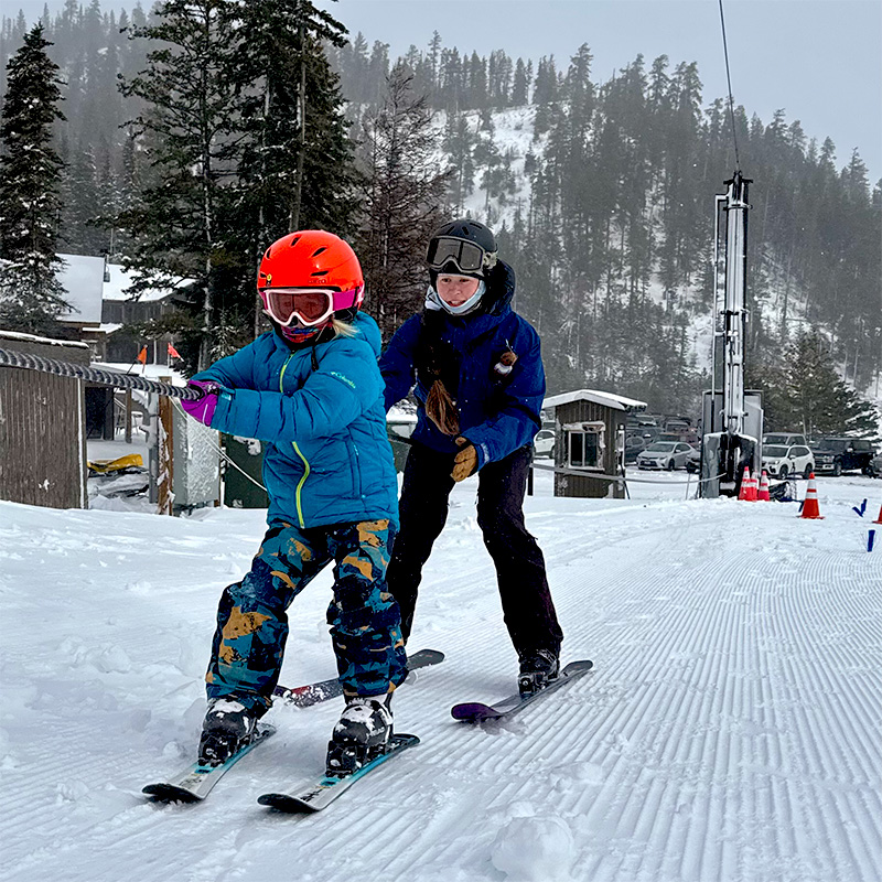 child on a rope tow taking a lesson