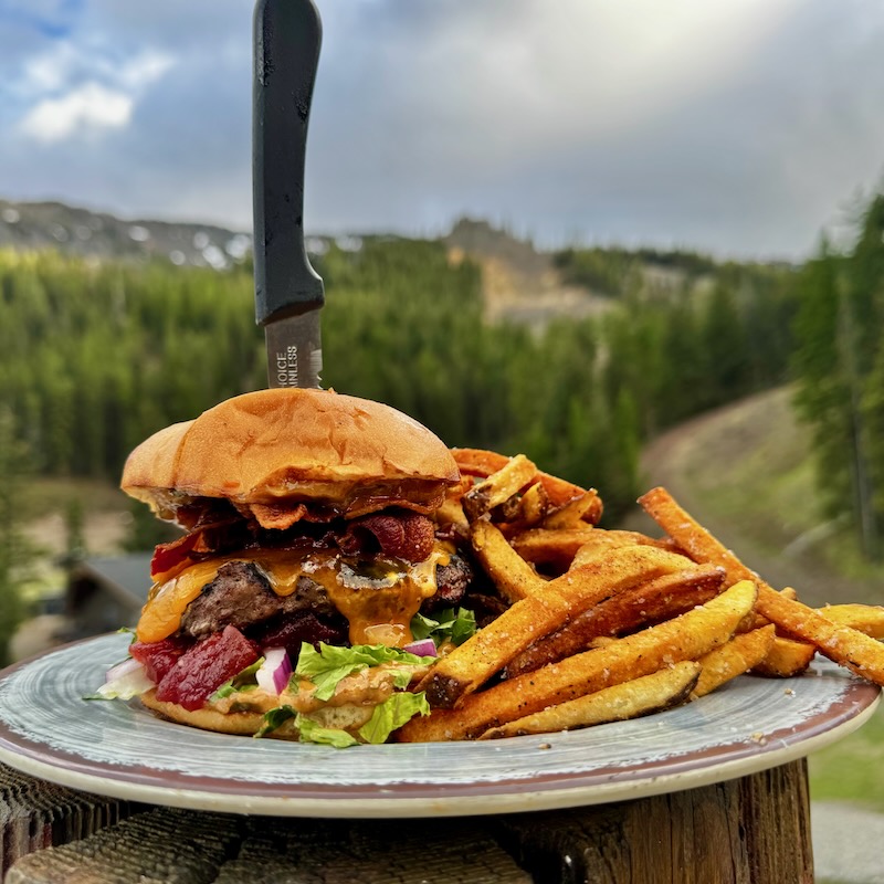 burger from the chair 5 pub in front of a mountain view.