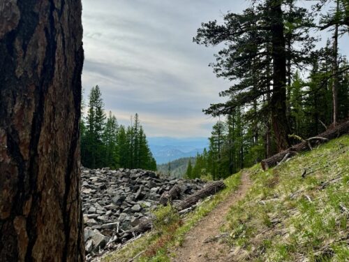 View northward from the Squilchuck Trail, overlooking a talus field and the Entiat mountains and foothills distantly.