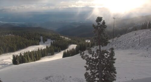 View of new snow at the top of Mission Ridge as sun begins to peek through the clouds.