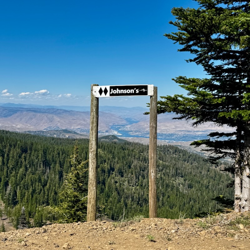 Johnson's Trail sign in front of the Columbia River from Mission Ridge.