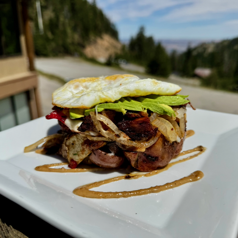 A plated sandwich topped with a fried egg from the Chair 5 Pub kitchen